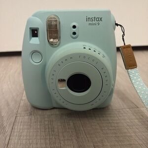 Light blue instax mini 9 Polaroid camera